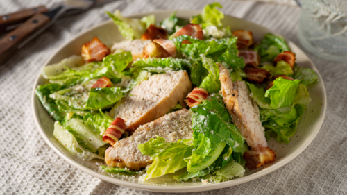 Chicken Caesar salad with crispy bacon